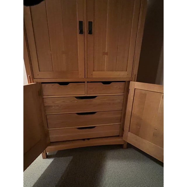 Add a timeless piece of American craftsmanship to your home with this stunning Stickley armoire. This piece embodies the...