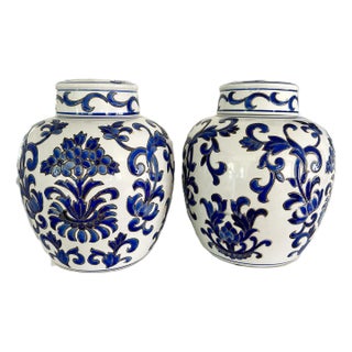 Vintage Chinoiserie Blue & White Chinese Porcelain Urns - A Pair For Sale
