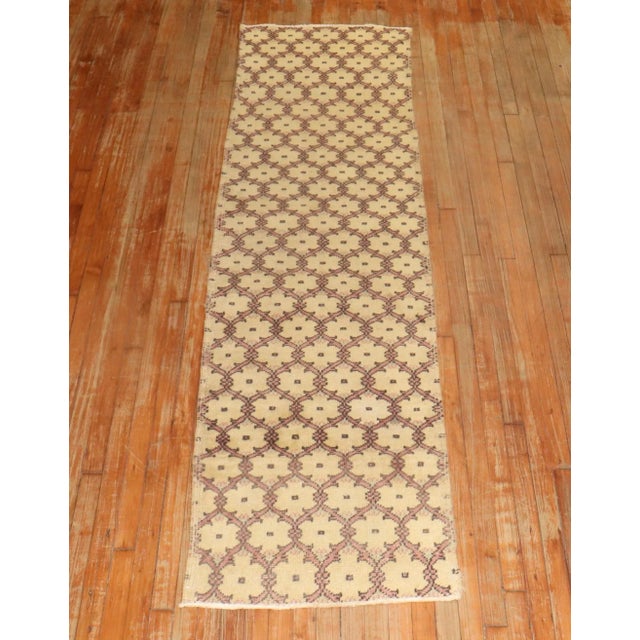 One of a kind, mid 20th-century hand-knotted Turkish anatolian small size narrow runner. Professionally washed &...