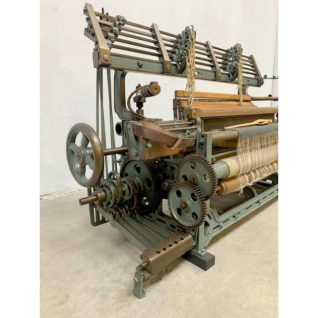 A beautiful antique metal loom with wooden details. This exceptional piece comes from a museum display case. Due to its...