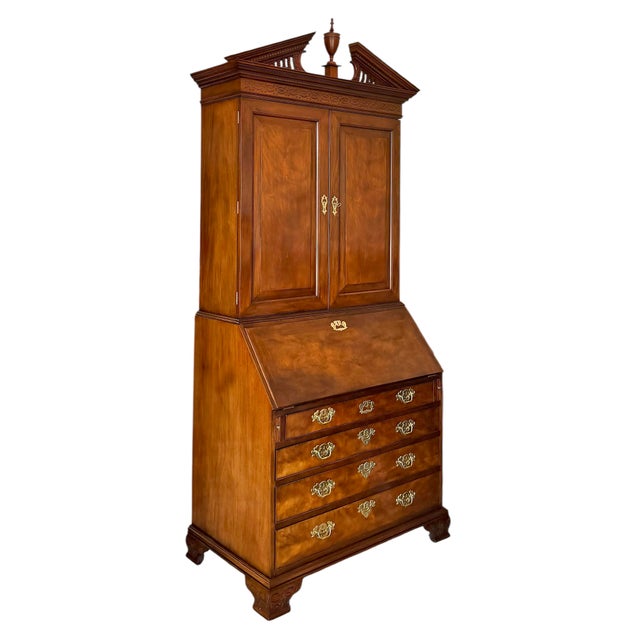 A late 20th century mahogany two-piece secretary reproduced from the 18th century original by Baker for the famed...