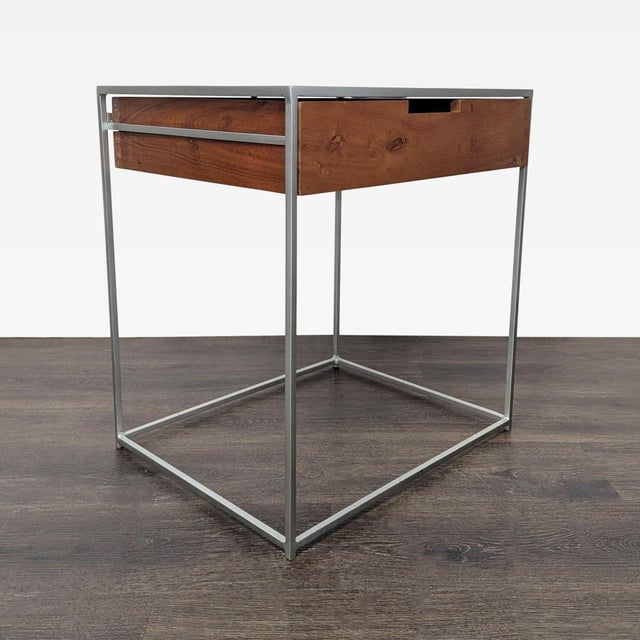Minimalist end table/nightstand with a wood drawer on a metal frame. Brand: CB2. Original Price: $229. Dimensions (in):...