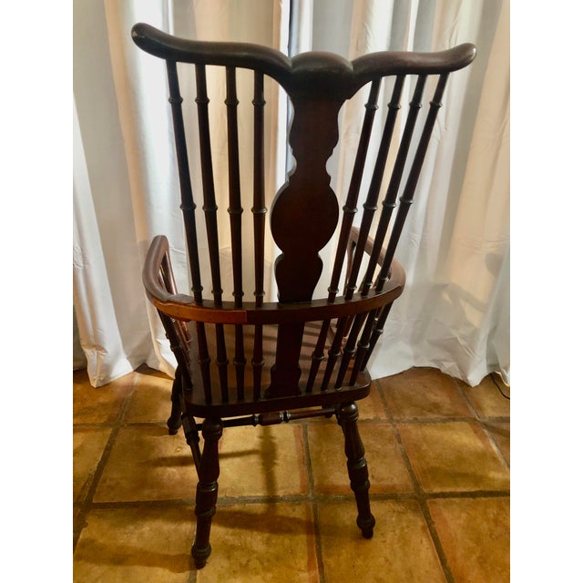 Elegant Windsor double arm chair with center medallion carving. All spindles are tight and very sturdy The left side of...
