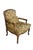 This exquisite vintage French Provincial style bergère armchair showcases the timeless elegance of fine Italian...