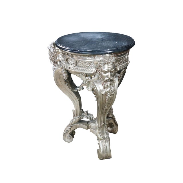Vintage Neoclassical Greek God pedestal table / plant stand by Royal Bronze Studio. A black marble top is supported by a...