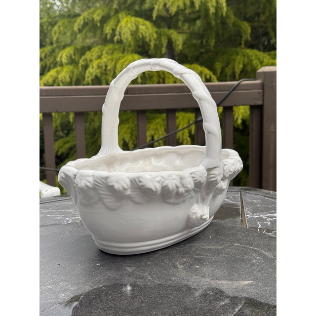 Here is a large-scale ceramic basket with strawberry motif in relief. Lovely on its own or filled with plants, especially...