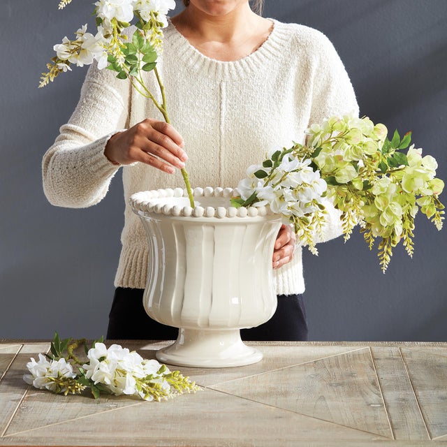 The Coletta Petite Flared Vase is handmade by Italian artisans in Tuscany, Italy. The subtle ribbing and handapplied...