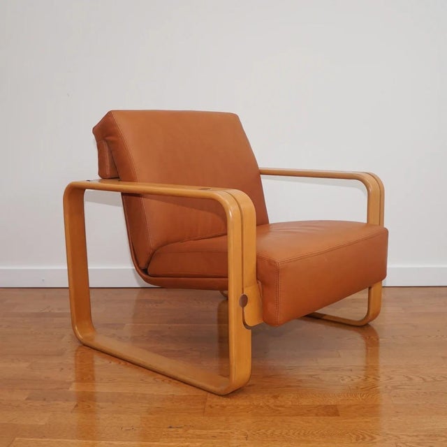 This 1970s Stoll Giroflex armchair has undergone a remarkable transformation with restored wood finish and new premium...