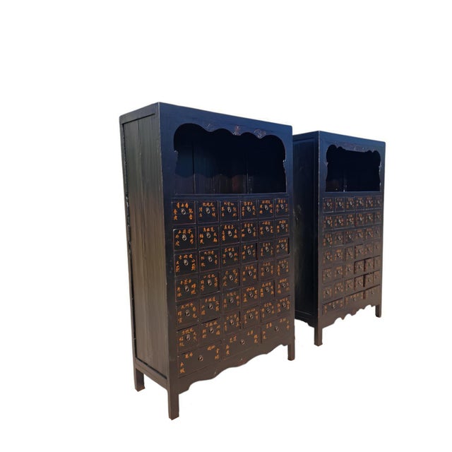 An authentic pair of antique Chinese apothecary cabinets dating to approximately 1846 during the Qing Dynasty. Originally...