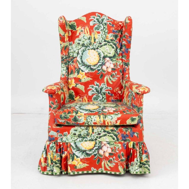 Foliate and Vegetable Pattern Red Fabric Upholstered Wingback Arm Chair. 44.25" H x 31.25" W x 22" D; seat: 18" H....
