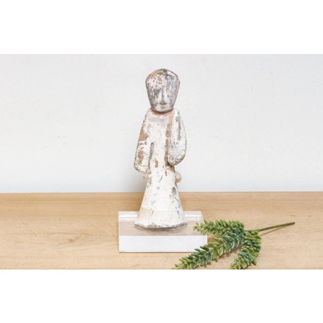 This antique pottery statue, crafted in the elegant style of the Han Dynasty, is a delightful representation of ancient...