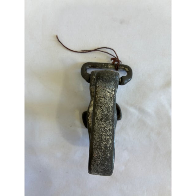 Vintage metal swivel hook with threaded base, likely from farm equipment, harness gear, or industrial machinery. This...
