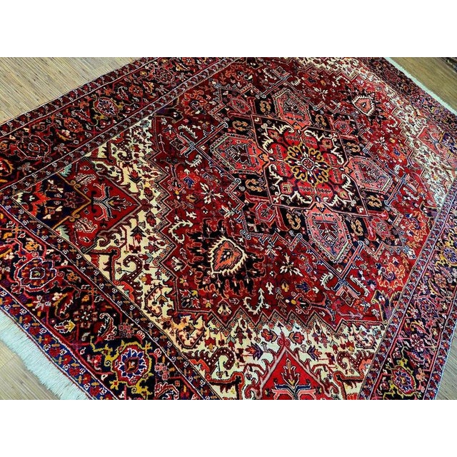 Hand-knotted Heriz Oriental rug | Material: Virgin wool on cotton | Size: 342 x 255 cm | Condition: Age-related condition,...