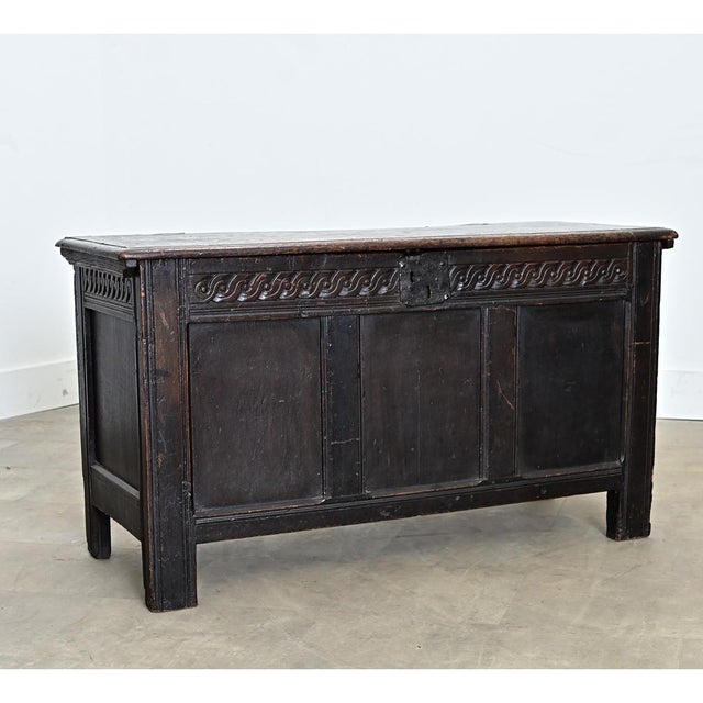 A French, solid oak coffer from the 1800s or earlier, this heavy storage trunk has a paneled exterior counterbalanced with...