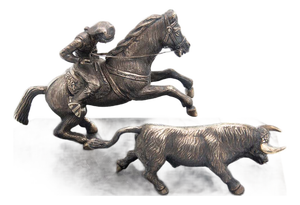 Campino Riding a Horse Leading a Bull