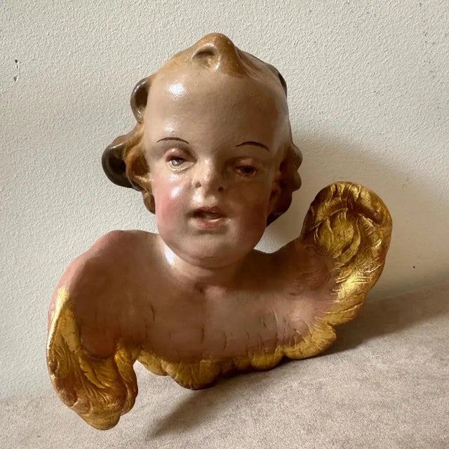This ceramic angel is a captivating piece of art, reflecting the ornate and dramatic characteristics typical of the...
