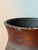 Handcrafted African earthenware vessel with geometric roulette, a rich burnished surface, and decades of authentic patina....