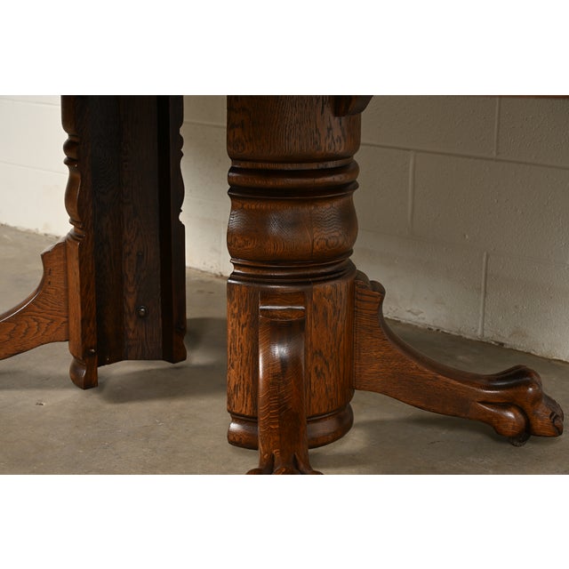 R. J. Horner Style Antique Victorian Carved Oak Split Pedestal Extension Dining Table With Lion Paw Feet | Newly Refinished For Sale - Image 12 of 14