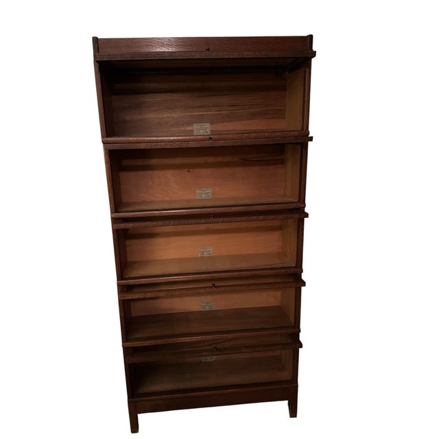 Early 1920’s Lawyers Bookcase 5 Stackable Shelves. Has original glass with brass pulls