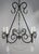 20th century hand wrought iron six light chandelier adorned with rock crystal pendulum shaped drops and garlands of...