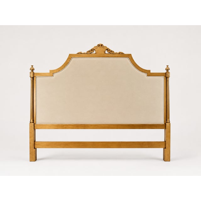 An exquisite Italian Neoclassical Louis XVI style upholstered headboard featuring an ornate, hand-carved solid wood frame...