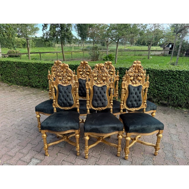 An extraordinary set of 7 Italian Baroque Rococo chairs, crafted circa 1900, showcasing the lavish elegance and artistry...