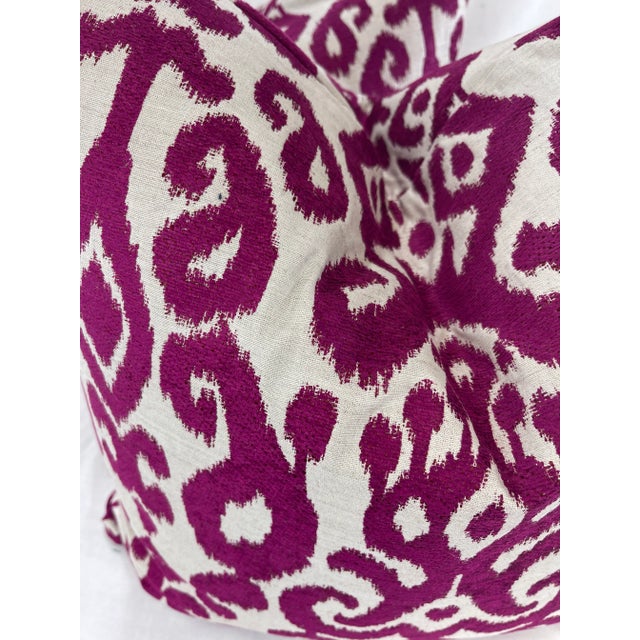 Custom pair of 22" pillows covered in a fuchsia ikat jaquard fabric. These pillows have tapered corners to prevent dog...