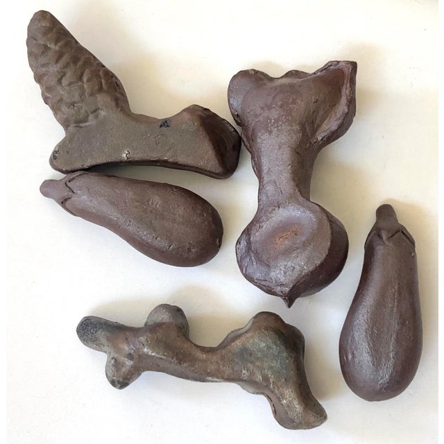 Traditional Japanese chopsticks holders made in ceramic of various styles including; beet, eggplant, pine cone and cherry...