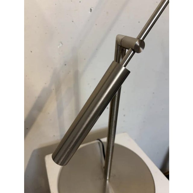 Metalarte Libra M table lamp. Design composed of matte nickel finish metal chassis with an articulated and movable arm....