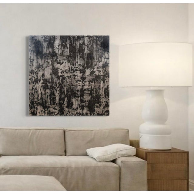 Dominance by J. Kent Martin presents a bold monochromatic field of black and warm gray, activated by dense vertical...