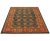 Handwoven Rug featuring a Tibetan design on a green colored field and rust border, accented in shades of light blue, red,...