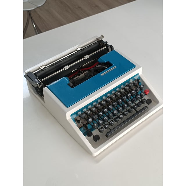 Beautiful Underwood 315 typewriter. Spain, 1970s. White and turquoise lacquered metal frame. In excellent condition and...