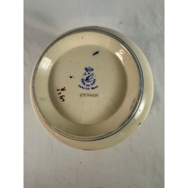 This beautiful, antique ceramic biscuit barrel (cookie jar) with silverplate lid and handle is a delightful presentation...