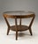 This sculptural round coffee table was designed by Karel Koželka and Antonín Kropáček around 1944 as part of an award-...