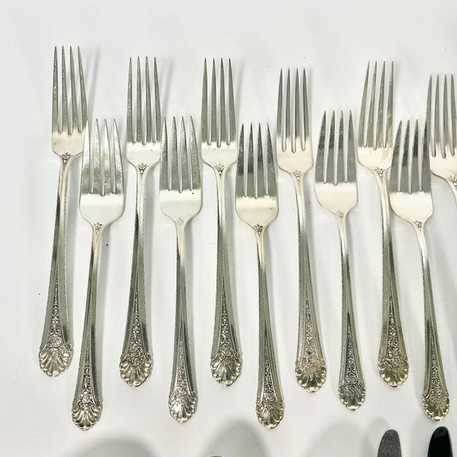 Vintage Home is pleased to present this vintage Sterling Silver Flatware Set from Towle Silversmiths. The pattern is from...