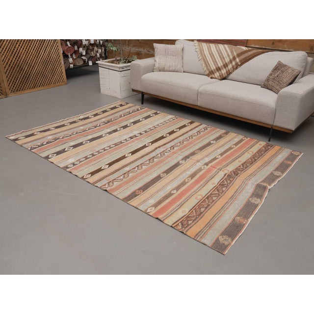 Vintage Hand-Knotted area rug is a semi-antique vintage area rug. The '70s Eastern region of Anatolia's unique rug is...