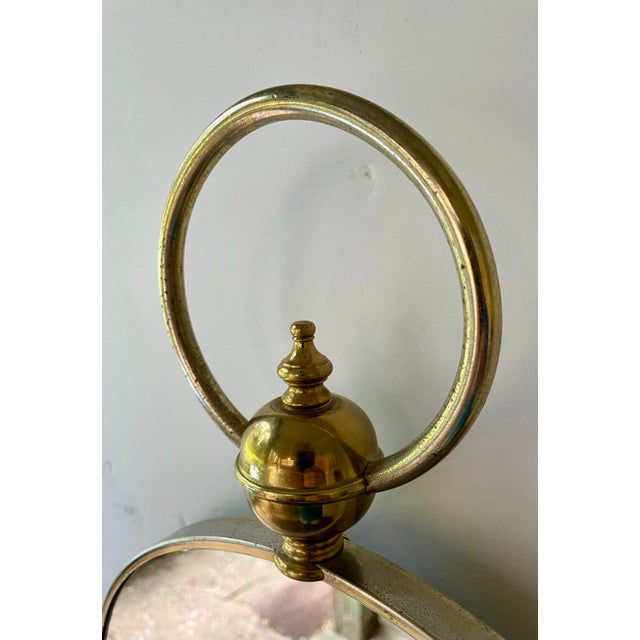 This Brass Loop Top Round Mirror takes inspiration from the classic design of a pocket watch, featuring a round brass...