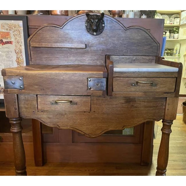 Originally used in a French boucherie, this antique butcher block table dates to the 1910s and brings with it a rich sense...