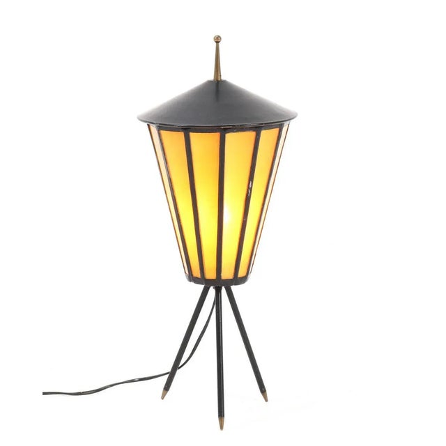 Stunning Mid-Century Modern table lamp. Striking French design from the 1950s. Black lacquered metal base on tripod legs....
