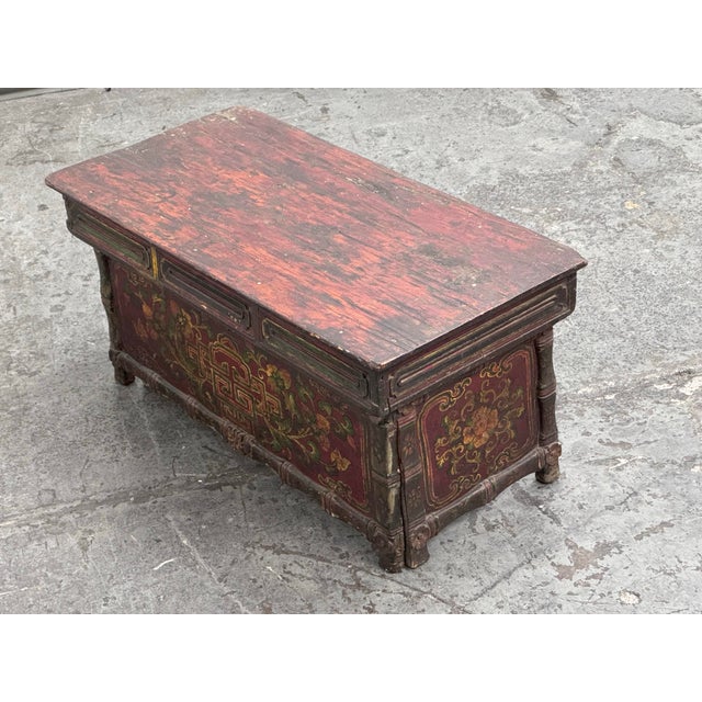 Design Plus Gallery presents an Antique Tibetan Folding Prayer Table. This rare antique Tibetan folding prayer table is a...