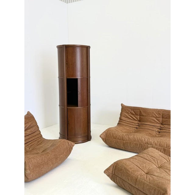 This rare and sculptural wooden cabinet, attributed to Gianfranco Frattini , is a beautiful example of Italian mid-century...