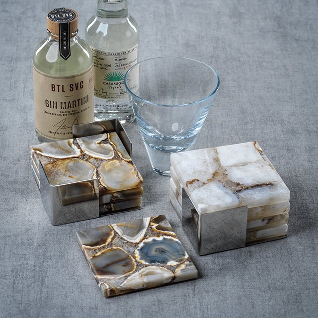 Your home should be accessorized as thoughtfully as your outfit. Our 4-set of agate coasters are an instant conversation...