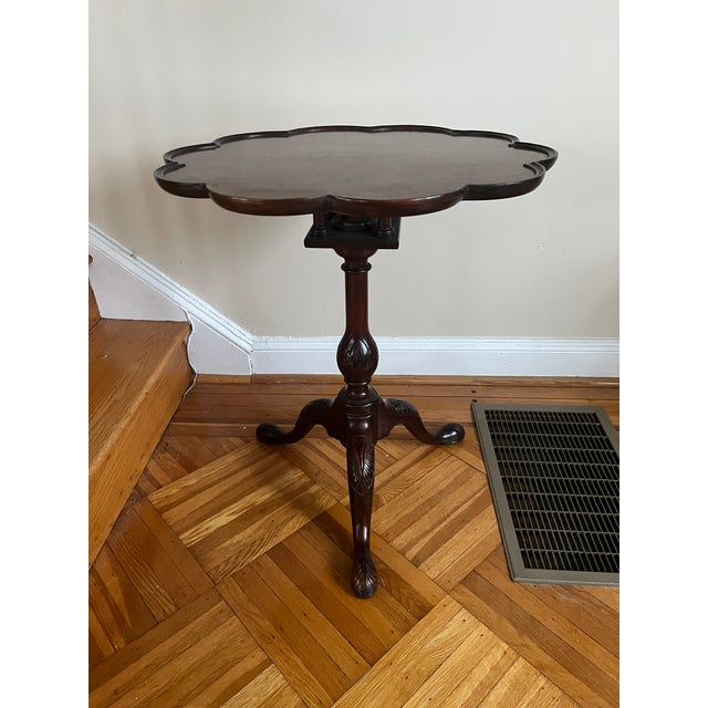A distinguished Chippendale-style piecrust tilt-top tea table by Kindel Furniture Company of Grand Rapids, Michigan, circa...