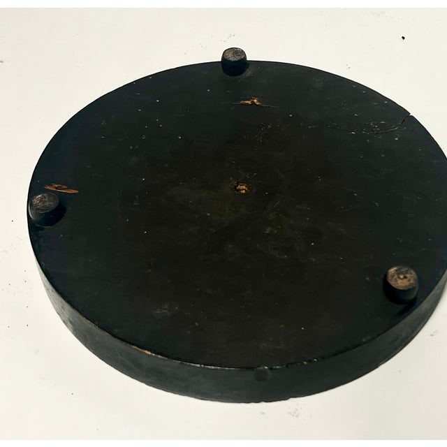 Glass cloche on a 9 1/2” round black three footed base. Beautiful decorative piece. Glass domes, often referred to as bell...