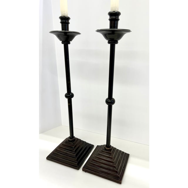 Pair Of Maitland Smith Sculptural Bronzed Iron Candlestick Holders Bring instant drama to a console, mantel, or dining...
