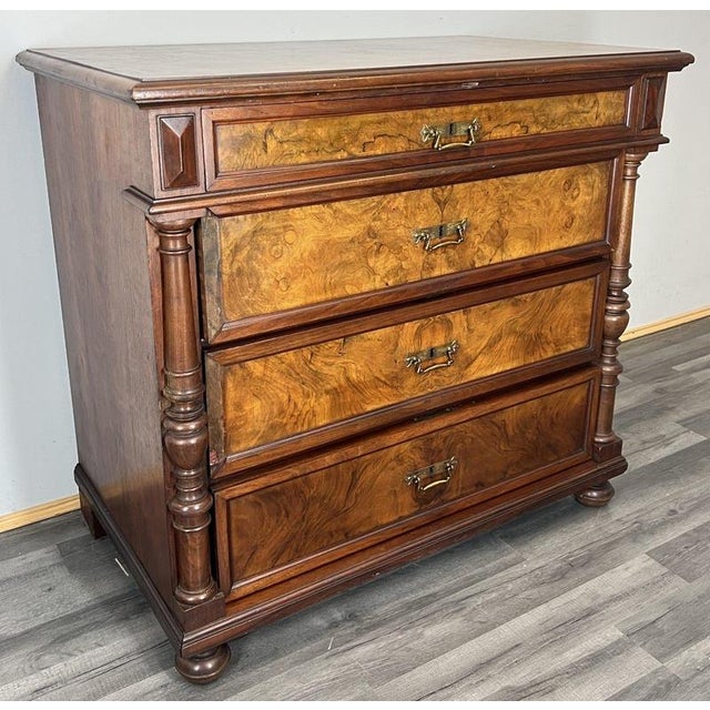 This beautiful French burr chest of drawers offers a refined and timeless presence, showcasing rich burr-front drawer...
