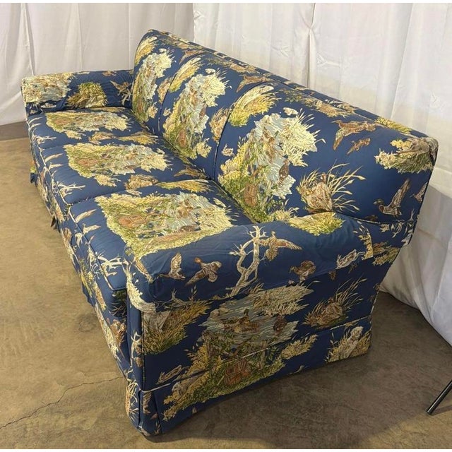 An exceptional, investment-grade three-piece English Country estate living room set consisting of a three-seater sofa and...