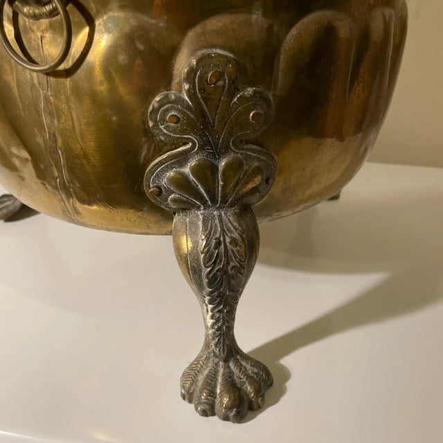 Antique brass planter or coal bucket with Lionhead ring pulls acanthus foliage and Paw feet