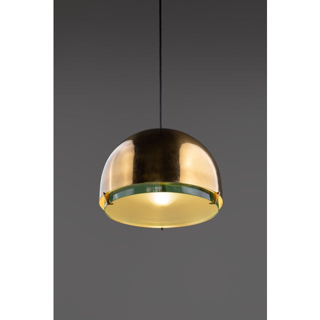 Max ingrand for fontana arte pendant or suspension light model 2409 consisting of dome-shaped brass shade and a thick...