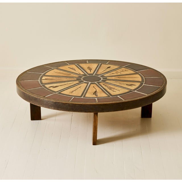 Coffee table by Roger Capron, produced in the 1960s. The circular top features Capron’s characteristic ceramic tile work...